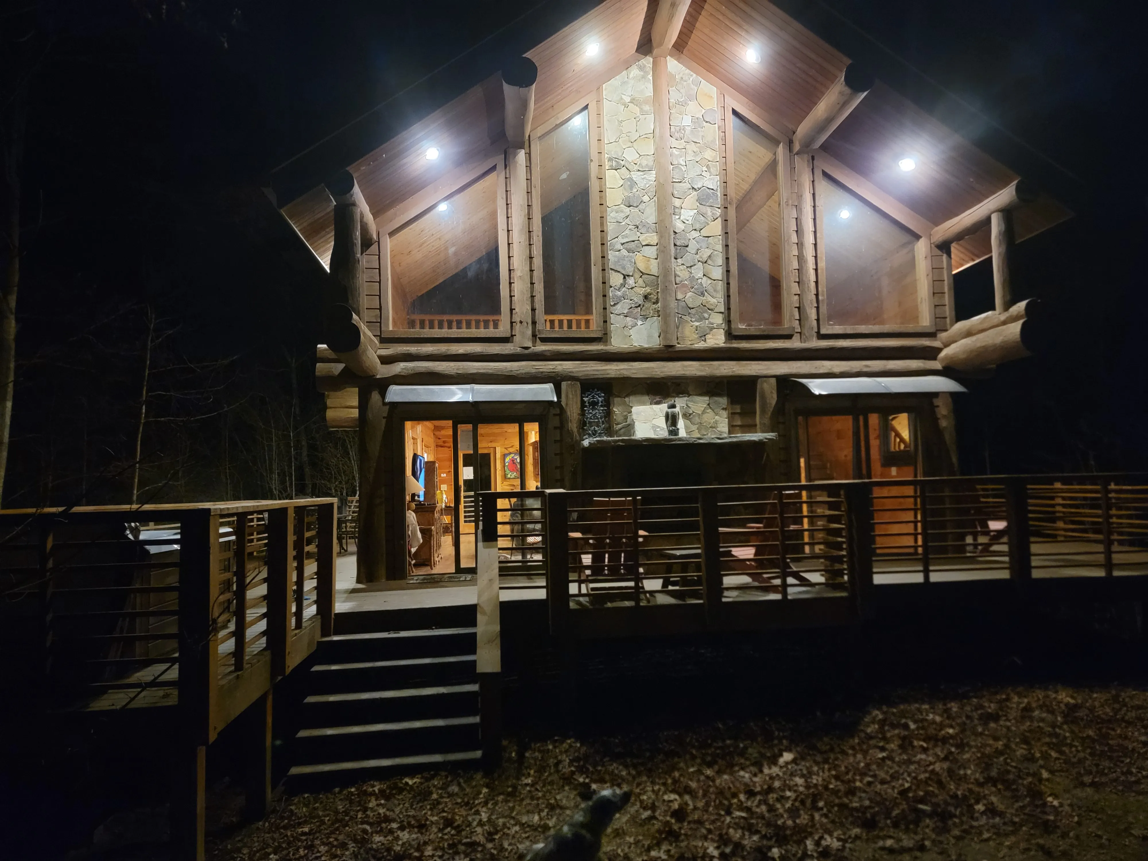 Exterior lighting illuminating a timber home at night