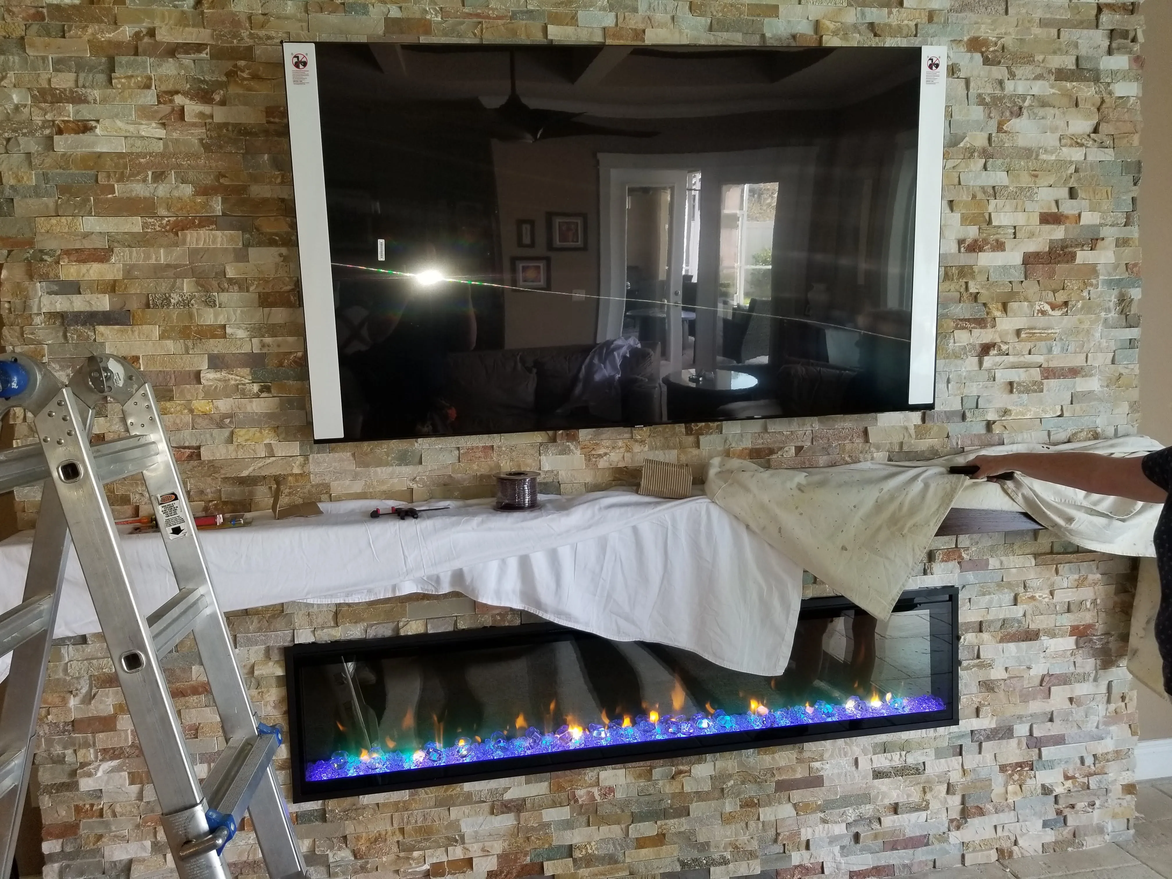 Electrical installation for television and fireplace feature wall